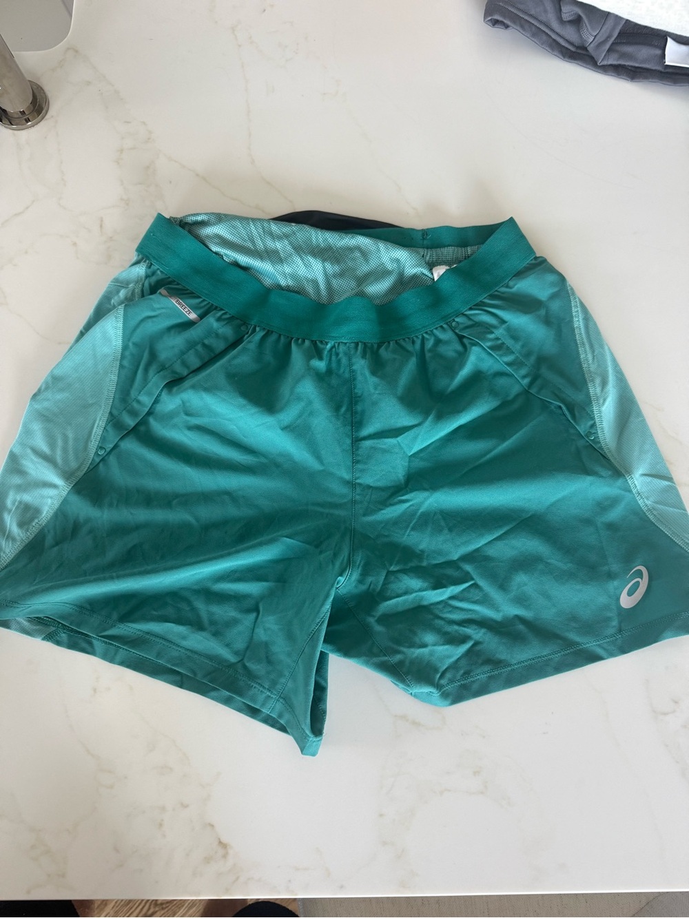ASICS Road 5” running shorts, men’s Medium, in Rainy Lake / Light Teal.